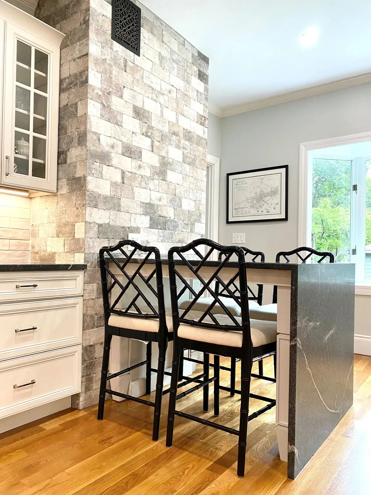 A kitchen with a table and chairs in it