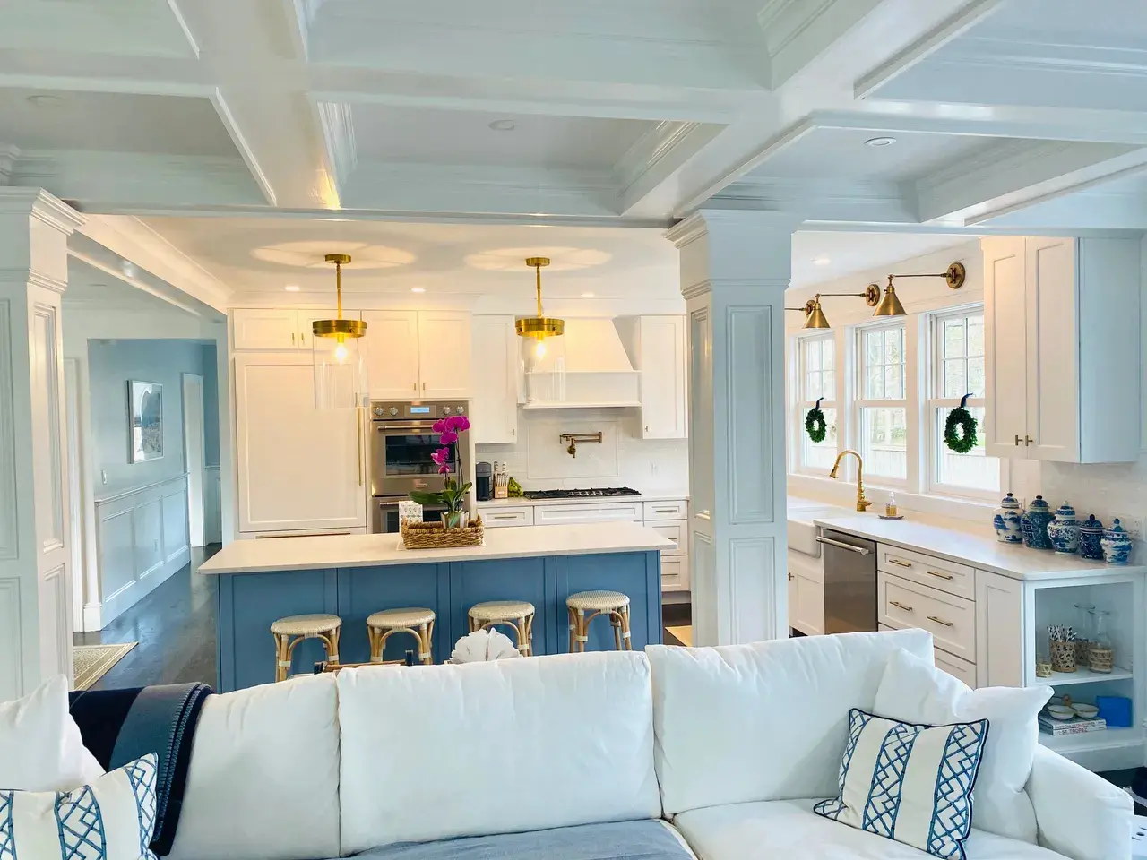 A living room with white walls and blue ceiling.