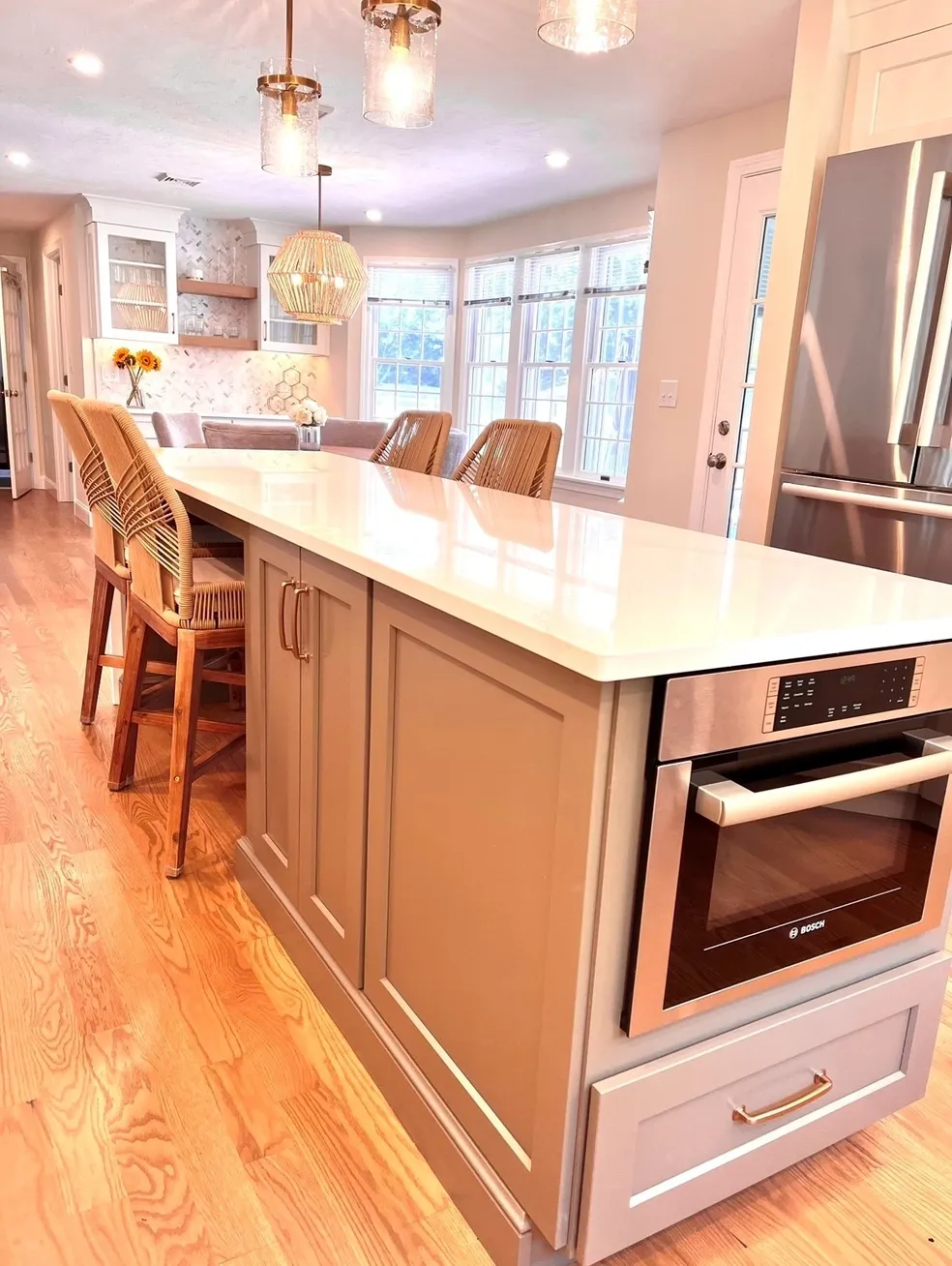 A kitchen with an island and microwave in it