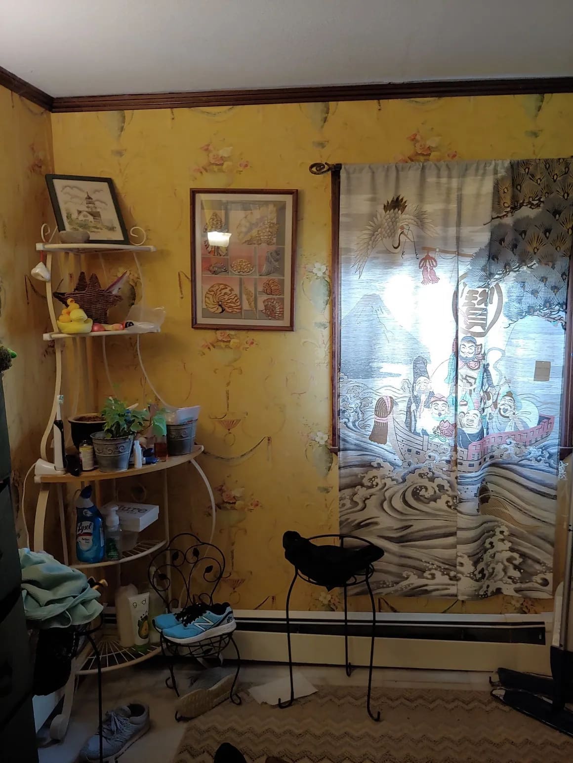 A room with yellow walls and a large window.