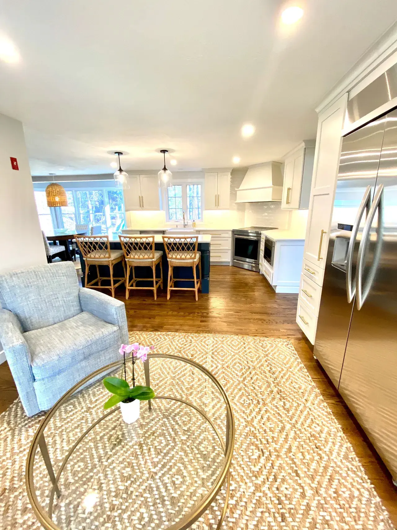 A living room with a couch and chairs in it