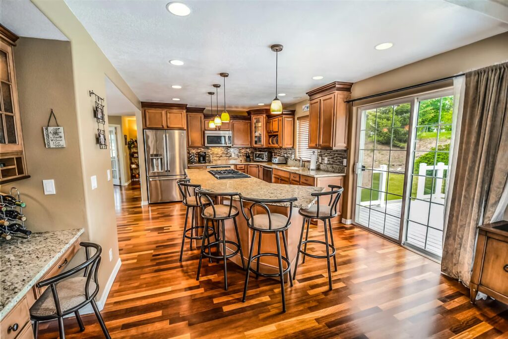Classic kitchen with granite countertops and wood cabinetry, included in our kitchen design services in Pembroke, MA.